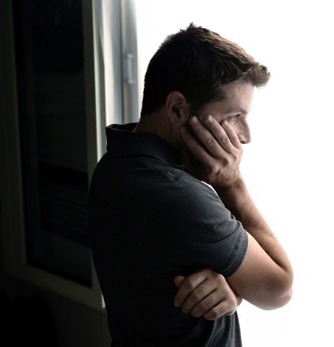 young man looking concerned, worried, and baffled - progression of addiction - summit bhc offers addiction treatment and drug and alcohol rehab in Louisiana, Texas, and California