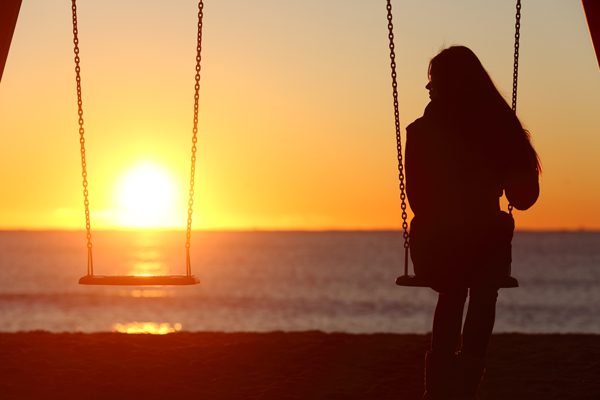 losing children to addiction - woman alone on swing - summit bhc
