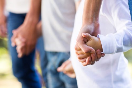 family roles in addiction recovery - family holding hands - summit bhc