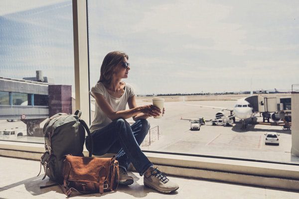 woman alone at airport traveling